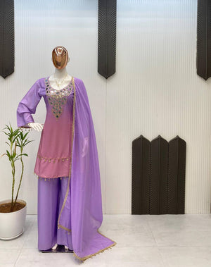 Purple traditional outfit with a matching dupatta on a mannequin against a neutral background