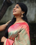 Woman wearing a traditional saree with a blurred background