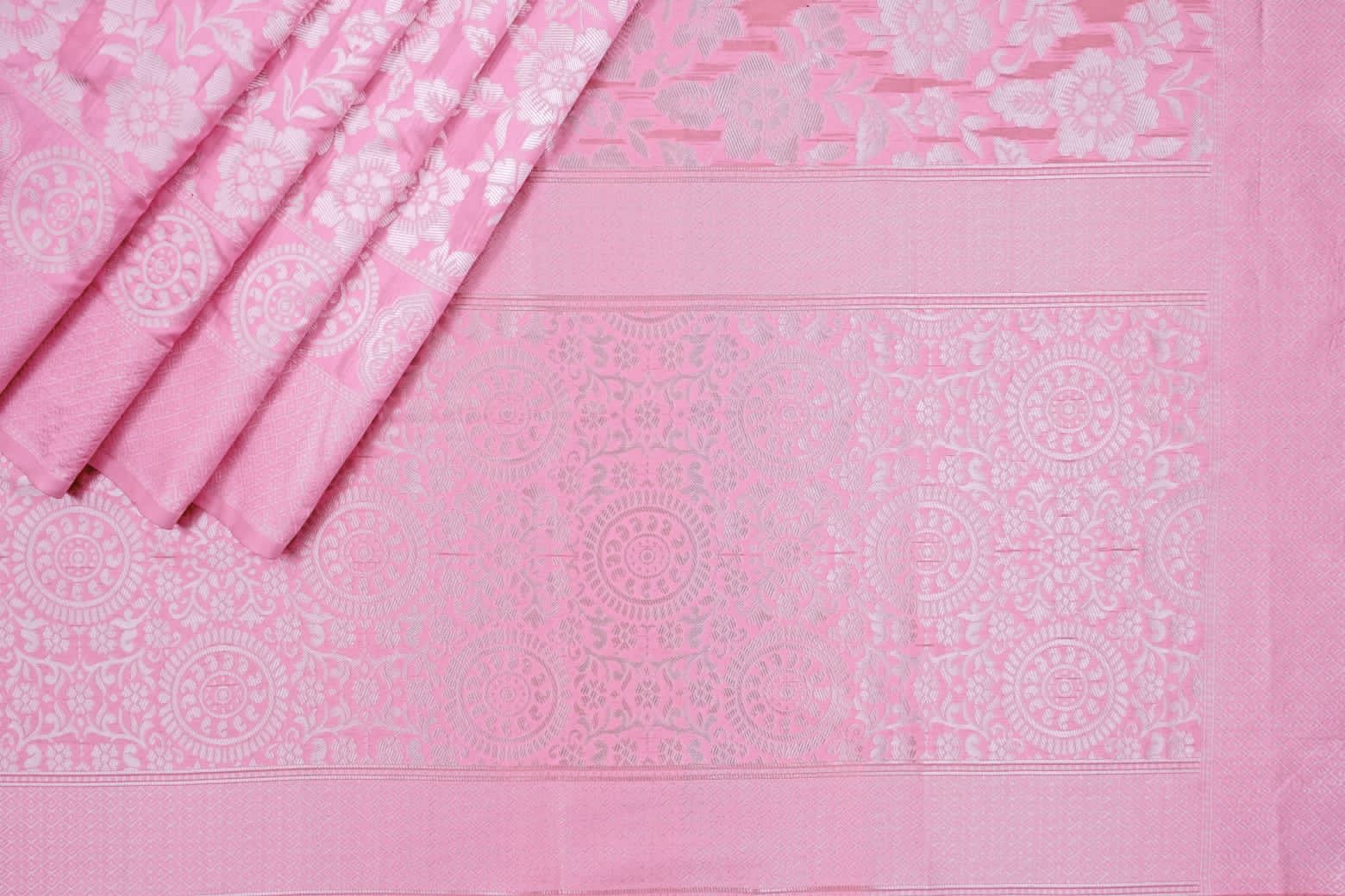 Pink fabric with white floral patterns
