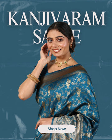 Woman wearing a blue saree with gold patterns on a dark blue background, featuring the brand 'Kanjivaram Saree'.