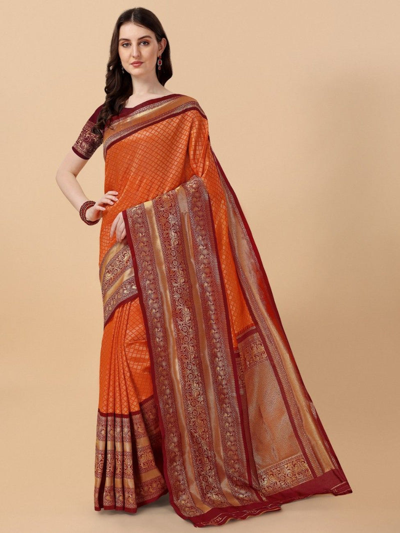 Orange saree with intricate patterns on a beige background