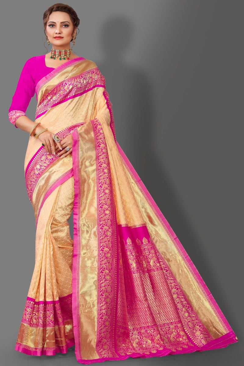 Beige and pink saree with intricate patterns on a gray background