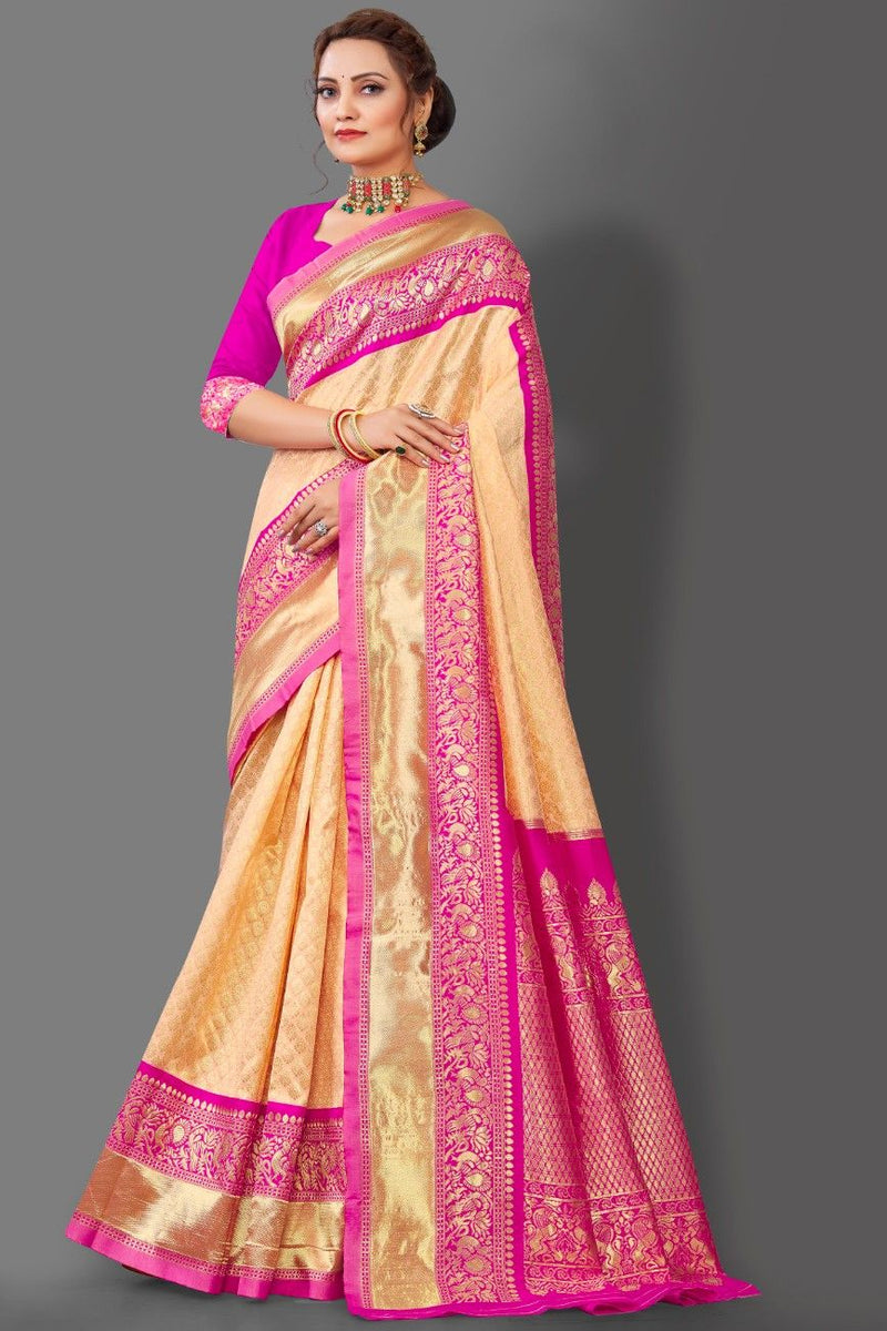 Beige and pink saree with intricate patterns on a gray background