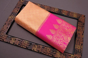 Saree with pink border on a decorative tray